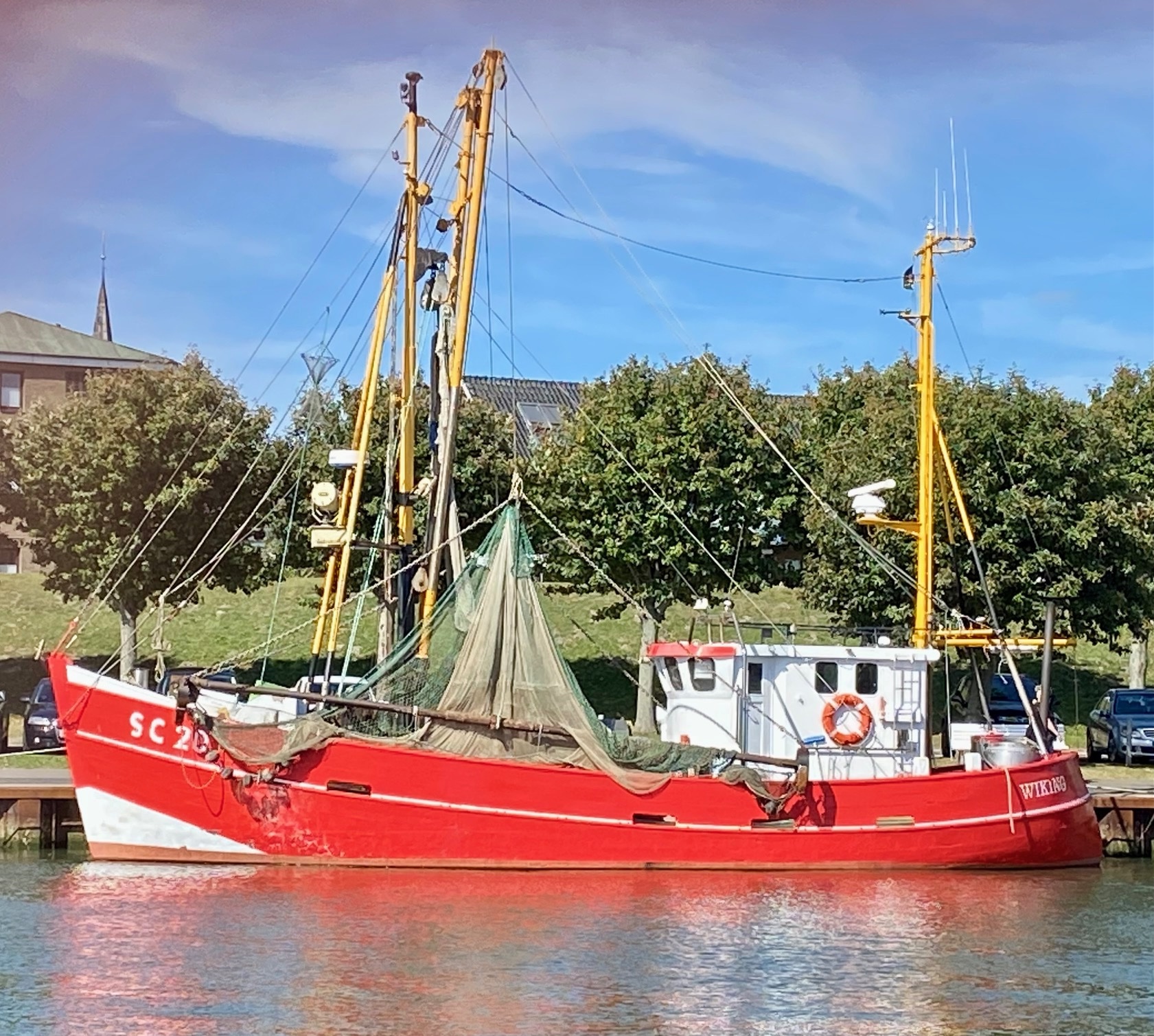 Kutter im Hafen – Sinnbild für Teamarbeit und Steuerung